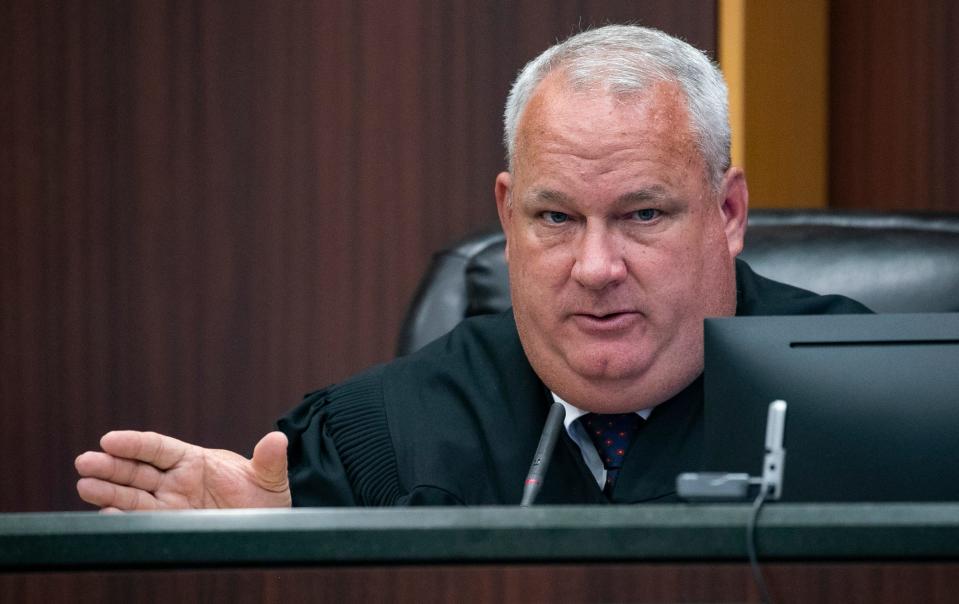 Judge Robert J. Branning speaks to an attorney during a pre-trial hearing in the case against Wisner Desmaret 
Tuesday, Sept. 6, 2022. Desmaret is accused in the shooting death of Fort Myers Police Officer Adam Jobbers-Miller. Desmaret, who police said was fleeing during a suspected theft of a cellphone, is accused of grabbing Jobbers-Miller's gun during a scuffle and shooting him in the head on July 21, 2018.