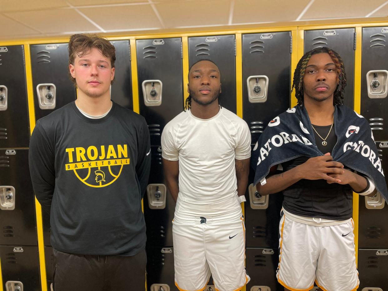 Greece Athena basketball stars Zee Johnson, Connor Osier and Khorie Reaves. The Trojans return their entire starting lineup after a Section V Class A1 finals run in 2022-23.