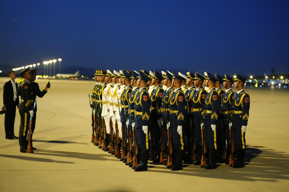 Members of an honor guard line up at the Beijing Capital International Airport prior to Chilean President Gabriel Boric's arrival as he attends the Belt and Road Forum in the Chinese capital on Sunday, Oct. 15, 2023. (Ken Ishii/Pool Photo via AP)