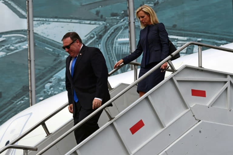 US Secretary of State Mike Pompeo (L) and US Homeland Security Secretary Kirstjen Nielsen disembark from their plane in Mexico City