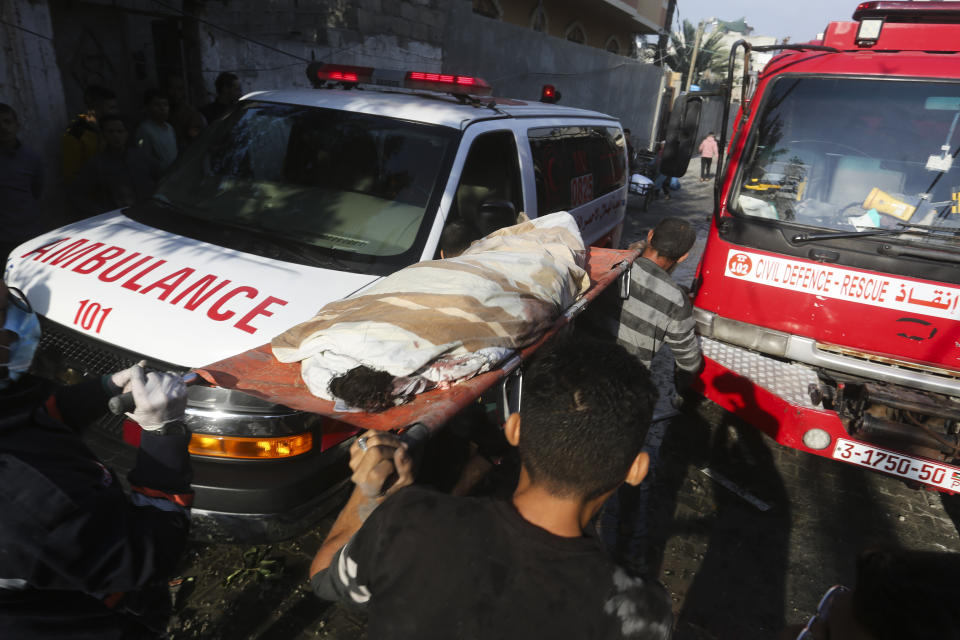 Palestinians evacuate wounded in Israeli bombardment Rafah, Gaza Strip, Friday, Dec. 1, 2023. (AP Photo/Hatem Ali)