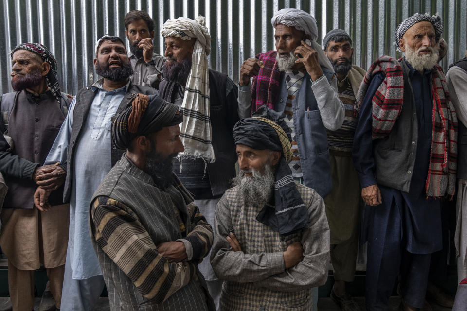 Nomadic Kashmiri men chat as they gather outside the forest shrine of Sufi saint Mian Nizamuddin Kiyanwi in Baba Nagri, northeast of Srinagar, Indian controlled Kashmir, Saturday, June 8, 2024. (AP Photo/Dar Yasin)