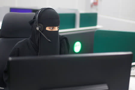 A Saudi woman works inside the first all-female call centre in the kingdomÕs security sector, in the holy city of Mecca, Saudi Arabia August 29, 2017. REUTERS/Suhaib Salem