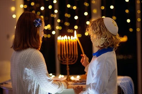   <span class="attribution"><a class="link " href="https://www.shutterstock.com/image-photo/kids-celebrating-hanukkah-jewish-festival-lights-1544613566" rel="nofollow noopener" target="_blank" data-ylk="slk:FamVeld/Shutterstock;elm:context_link;itc:0;sec:content-canvas">FamVeld/Shutterstock</a></span>