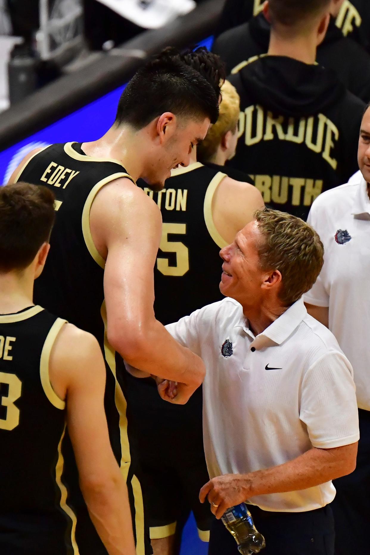 Nov 20, 2023; Honolulu, Hawaii, USA; 
Gonzaga Bulldogs head coach Mark Few interacts with Purdue Boilermakers center Zach Edey (15) after the game at SimpliFi Arena at Stan Sheriff Center. Mandatory Credit: Steven Erler-USA TODAY Sports