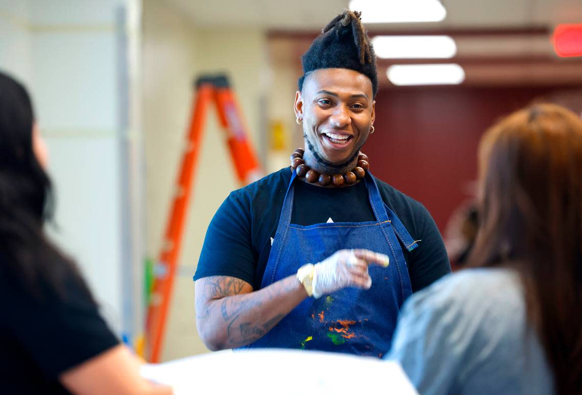 West Charlotte artist Michael Grant on Tuesday, May 2, 2023. Grant is working with West Charlotte High students to create a mural in one of the school’s hallways.