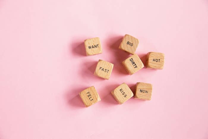 an image of block letters spelling out "want, big, fast, dirty, hot" on a pink background