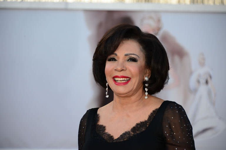 Singer Dame Shirley Bassey arrives on the red carpet for the Oscars on February 24, 2013 in Hollywood, California