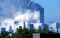 Two commercial jet liners crash into the World Trade Center, consequently causing both towers to implode and fall (3 of 6) (Photo by James Devaney/WireImage)