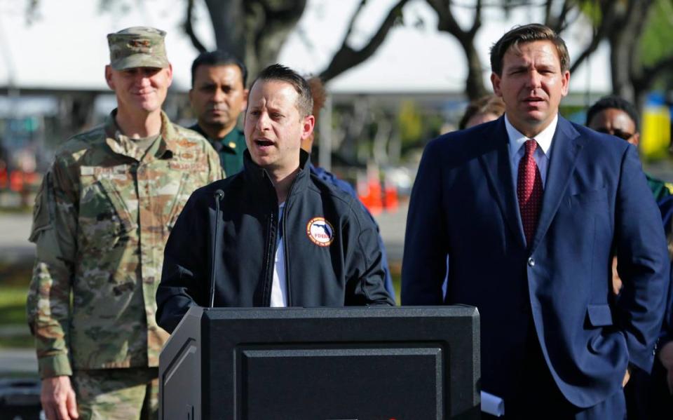 Florida’s Division of Emergency Management Director Jared Moskowitz, next to Florida Gov. Ron DeSantis, talks to the media at a press conference at the Broward County mobile testing site at C.B. Smith Park in Pembroke Pines on Thursday, March 19, 2020.