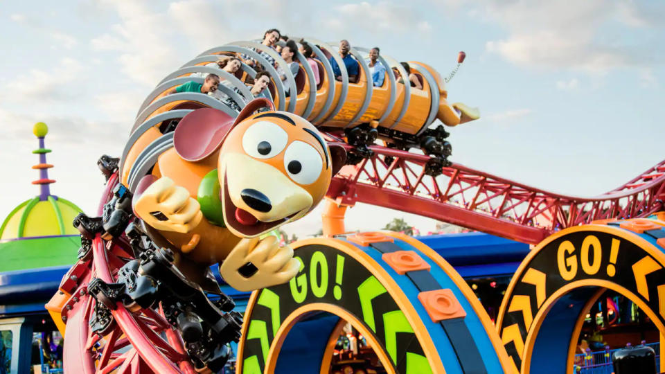 Riders experiencing a turn on the Slinky Dog Dash.