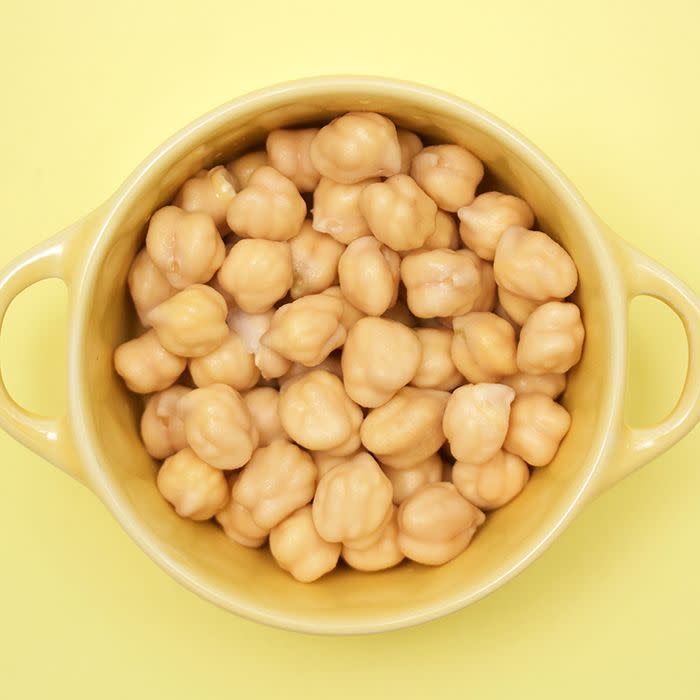 <p>Chickpeas aren't just a solid source of protein — they're also a great option to eat if you need to lower your cholesterol. "One <a href="https://www.ncbi.nlm.nih.gov/pmc/articles/PMC4016088/" rel="nofollow noopener" target="_blank" data-ylk="slk:study;elm:context_link;itc:0;sec:content-canvas" class="link ">study</a> found that eating pulses, like lentils and dried peas, daily significantly lowered bad 'LDL' cholesterol levels by about 5 percent," says Gorin. "One of my favorite way to eat pulses is roasting chickpeas."</p>