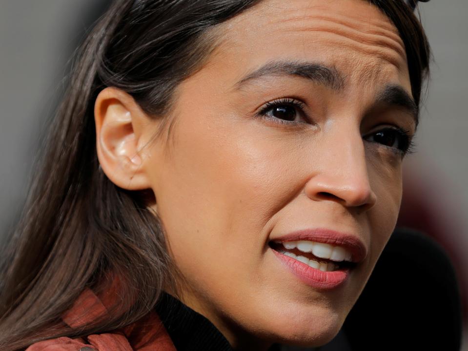 Congresswoman Alexandria Ocasio-Cortez addresses media as she arrives to vote early at a polling station in The Bronx, New York City (REUTERS)