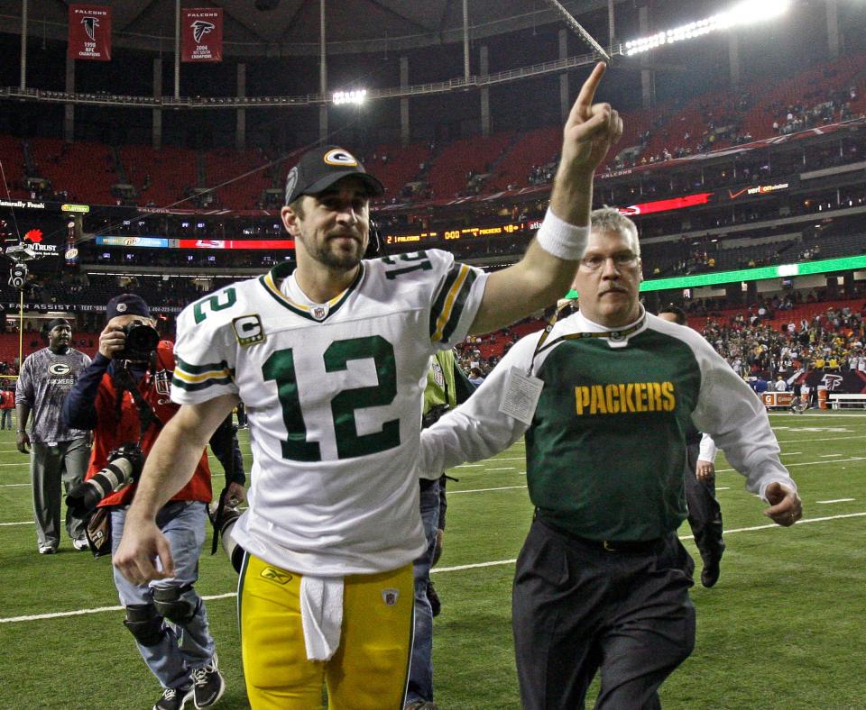 Aaron Rodgers waves to Packer fans after beating the Atlanta Falcons at the Georgia Dome in Atlanta on Saturday, January 15, 2011.