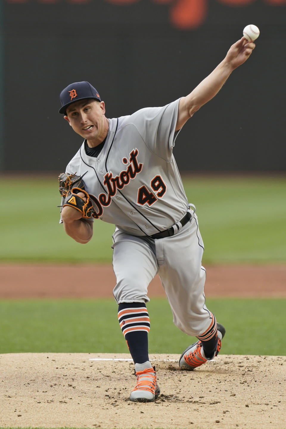 Detroit Tigers starting pitcher Derek Holland delivers during the first inning of the team's baseball game against the Cleveland Indians, Friday, April 9, 2021, in Cleveland. (AP Photo/Tony Dejak)