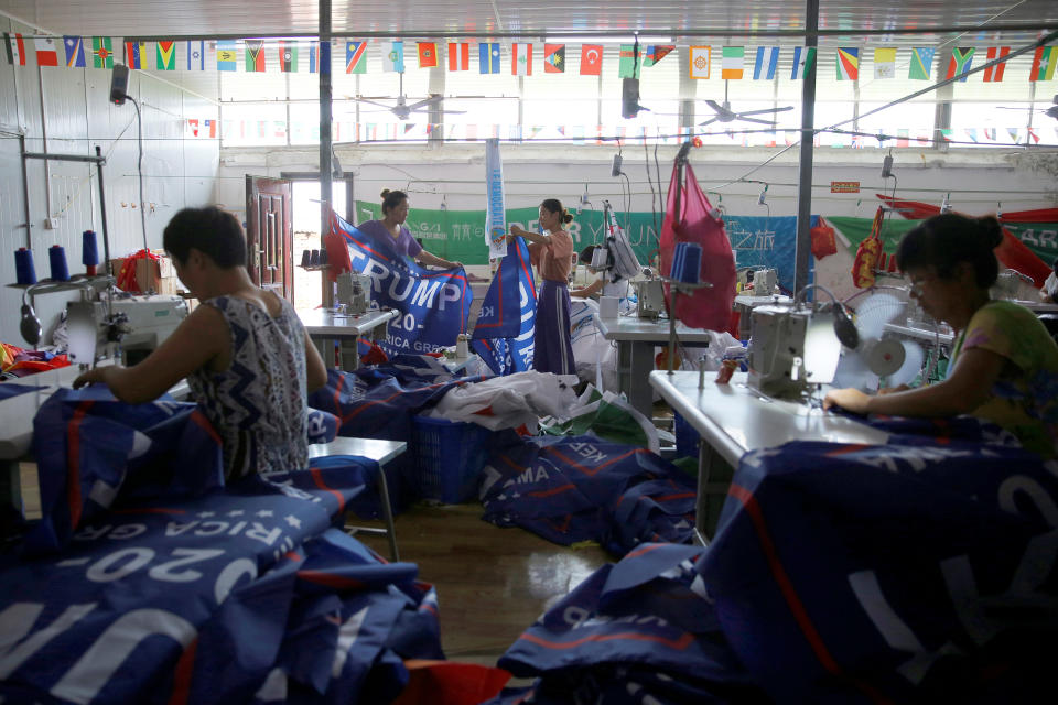 <p>Workers make flags for U.S. President Donald Trump’s “Keep America Great!” 2020 re-election campaign at Jiahao flag factory in Fuyang, Anhui province, China July 24, 2018. (Photo: Aly Song/Reuters) </p>