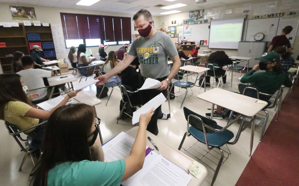 One thing David Finkle has learned while teaching during a pandemic: It's a draining process to try to keep socially distanced students in the classroom and those learning remotely all engaged. He used to take regular runs in the mornings before school; now he feels too worn down.