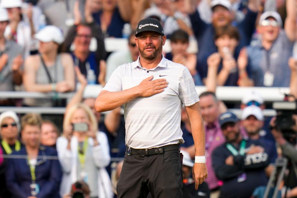 Michael Block acknowledges the fans on the 18th green after his final round of the PGA Championship at Oak Hill Country Club in Rochester, New York on May 21, 2023.