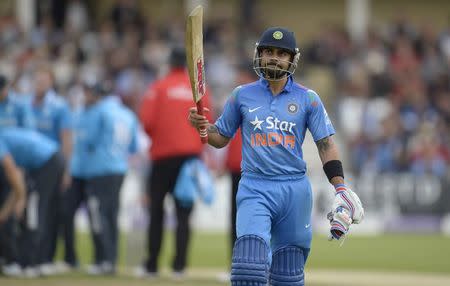 India's Virat Kohli leaves the field after being dismissed during the third one-day international cricket match against England at Trent Bridge cricket ground, Nottingham, England August 30, 2014. REUTERS/Philip Brown