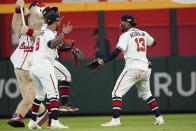 Atlanta Braves outfielders Ronald Acuna Jr. (13) Atlanta Braves Eddie Rosario (8) and Atlanta Braves Michael Harris II celebrate a win after the ninth inning in Game 2 of baseball's National League Division Series between the Atlanta Braves and the Philadelphia Phillies, Wednesday, Oct. 12, 2022, in Atlanta. The Atlanta Braves won 3-0. (AP Photo/John Bazemore)