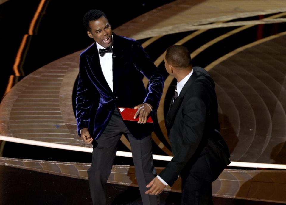 Chris Rock and Will Smith are seen onstage during the 94th Annual Academy Awards at Dolby Theatre on March 27, 2022 (Getty Images)