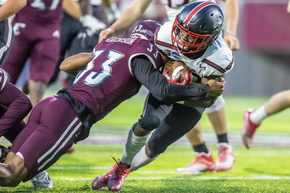 Eastern Kentucky Colonels Matthew Jackson (33) tackles Gardner-Webb running back Narii Gaither (22) during Saturday’s FCS playoffs game in Richmond.