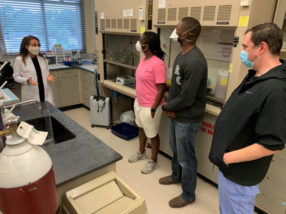 Burrell College of Osteopathic Medicine students speak to Florida Tech assistant professor Kenia Nunes, a vascular biologist, during a 2020 campus tour.