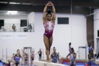 Simone Biles works on her routine on the balance beam during training at the Stars Gymnastics Sports Center in Katy, Texas, Monday, Feb. 5, 2024. Biles begins preparations for the Paris Olympics when she returns to competition at the U.S. Classic in Hartford, Connecticut on Saturday. Biles, who cited mental health concerns while removing herself from several competitions at the Tokyo Olympics, says she is better prepared for the pressure competing presents this time around. (AP Photo/Michael Wyke)