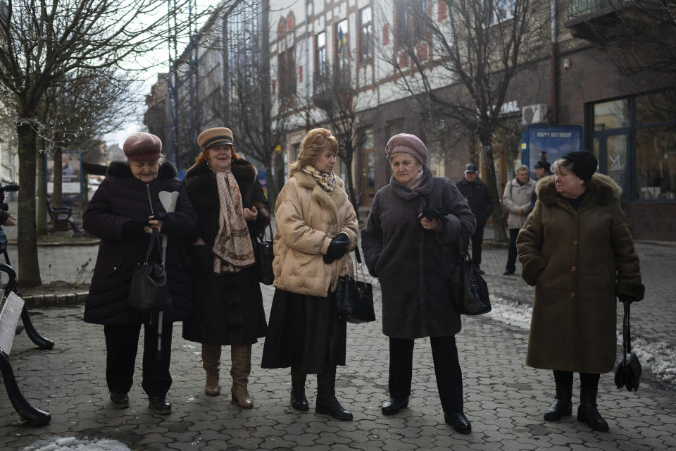Members of Ukraine's ethnic Hungarian minority leave after attending mass at a Catholic church in Uzhhorod, Sunday, Jan. 28, 2024. Ukraine amended its laws to comply with EU membership requirements, and restored many of the language rights for minorities demanded by Budapest but Hungary's government has indicated it is not fully satisfied — a potentially explosive sticking point as EU leaders meet Thursday, Feb. 1, 2024 to try and break Orban's veto of a major aid package earmarked for Kyiv. (AP Photo/Denes Erdos)