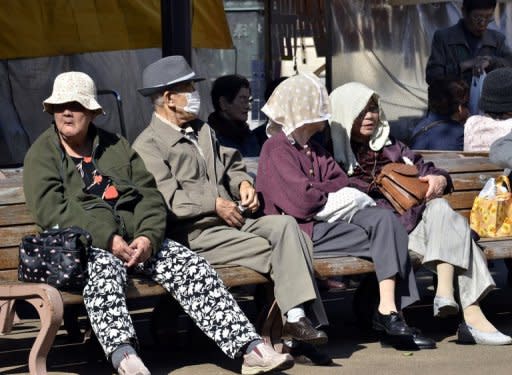 Elderly people take a rest on benches in Tokyo last October. Problems at the AIJ pension fund have affected 880,000 Japanese employees