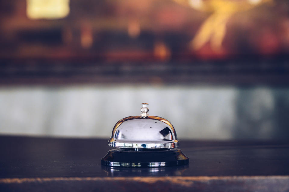 A close-up of a service bell on a countertop. No people are in the image