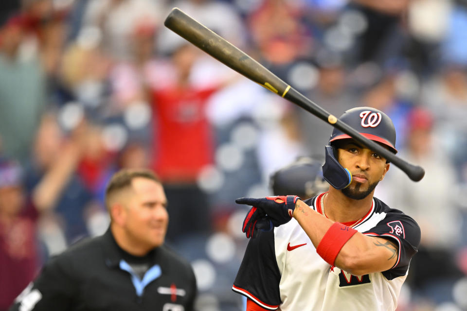 Washington Nationals' Eddie Rosario tosses his bat after hitting a two run go-ahead home run during the seventh inning of a baseball game, Sunday, May 5, 2024, in Washington. (AP Photo/John McDonnell)