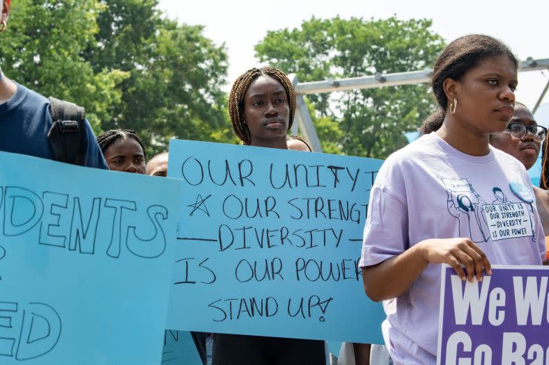 Proponents of affirmative action hold signs during a protest at Harvard University in Cambridge, Massachusetts, on July 1. Days earlier, the Supreme Court banned the use of race and ethnicity in university admissions, a move that prompted the Department of Education to issue new strategies for diversifying campuses. (Photo by Joseph Prezioso/AFP via Getty Images)