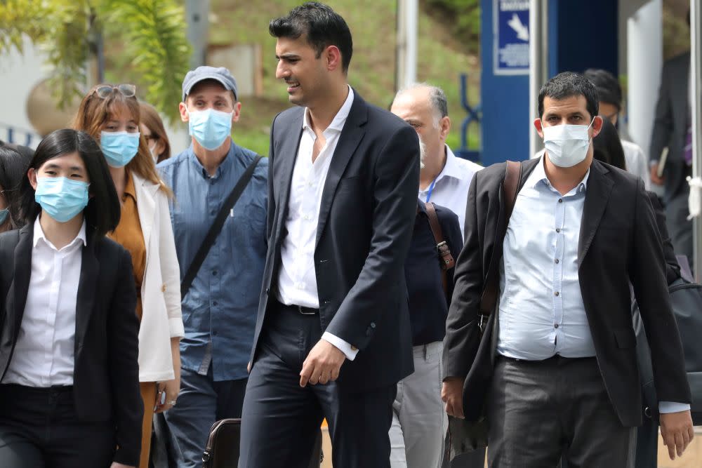 Al Jazeera staff leave Bukit Aman police headquarters after being questioned by the police over a documentary about the country’s arrests of undocumented migrants in Kuala Lumpur July 10, 2020. — Reuters pic