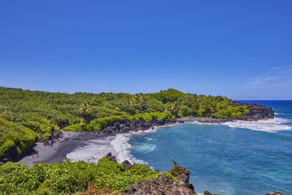 View of Honokalani beach,A black sand lava beach at Waianapanapa State Park,Road to Hana,Maui,Hawaii,USA