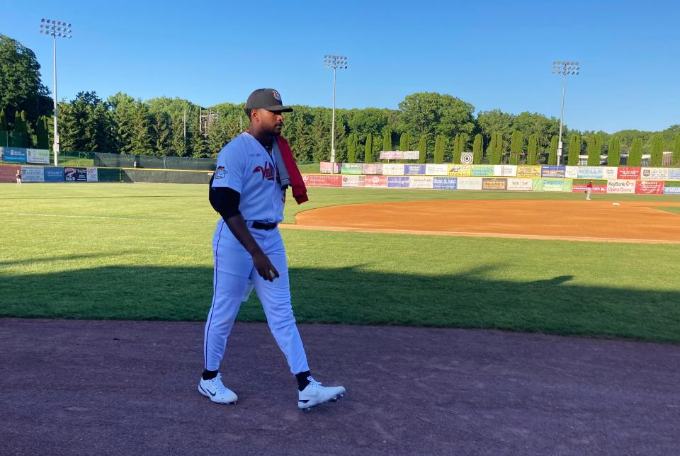 Former Vanderbilt star right-hander Kumar Rocker walks in from the bullpen at Joseph L. Bruno Stadium in Troy, N.Y., Saturday, June 4, 2022, prior to his first start for the Tri-City ValleyCats of the Class A independent Frontier League. (AP Photo/John Kekis)