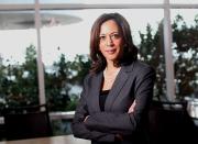 <p>While posing for a picture at the California Democrats State Convention, the then Attorney General wore her classic combination of dark-hued blazer and blouse, with a double string of pearls, and her pearl stud earrings. </p>