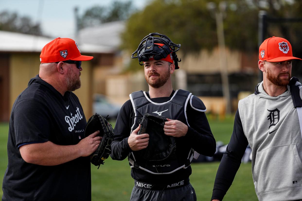 Detroit Tigers catchers coach Ryan Sienko talks to catchers Jake Rogers and Carson Kelly during spring training at Tigertown in Lakeland, Fla. on Tuesday, Feb. 13, 2024.