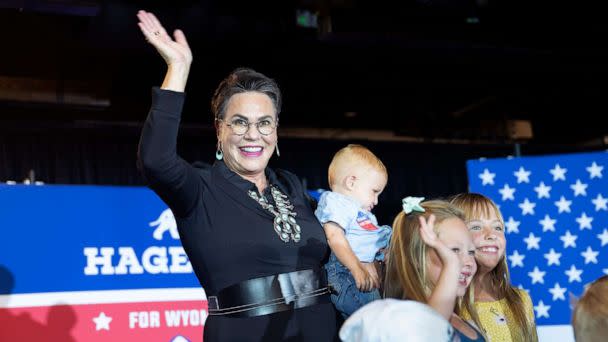 PHOTO: Wyoming Republican congressional candidate Harriet Hageman waves as she takes a picture with children during a primary election night party, Aug. 16, 2022, in Cheyenne, Wyo. (Michael Smith/Getty Images)