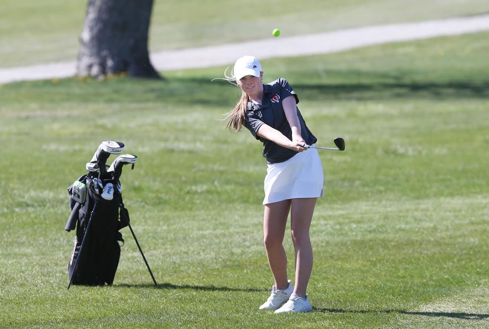 ADM's Kenzee Lathrop takes a shot from the fairway during a dual boys and girls golf meet against Gilbert on Monday, April 15, 2024, at Ames Golf & Country Club.