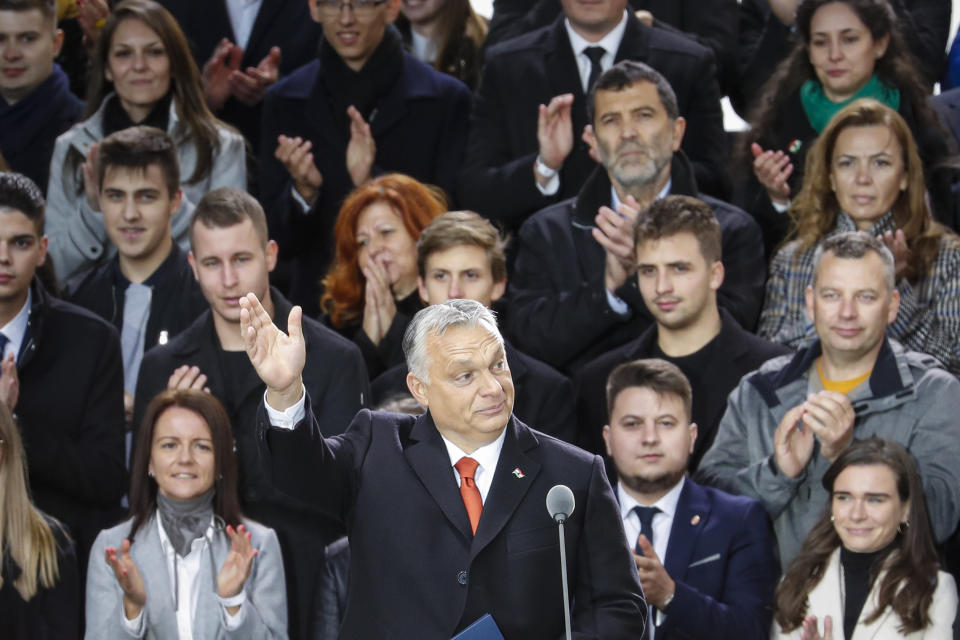 Hungarian Prime Minister Viktor Orban waves to supporters during celebration the 65th anniversary of the 1956 Hungarian revolution, in Budapest, Hungary, Saturday, Oct. 23, 2021. Thousands of supporters of Prime Minister Viktor Orban, who is expected to deliver a speech marking the 65th anniversary of the 1956 Hungarian revolution, march in Budapest, Hungary to demonstrate loyalty to his right-wing government. (AP Photo/Laszlo Balogh)