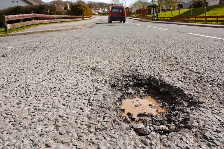 The government is trialling a new system to spot potholes early, using cameras mounted on bin lorries