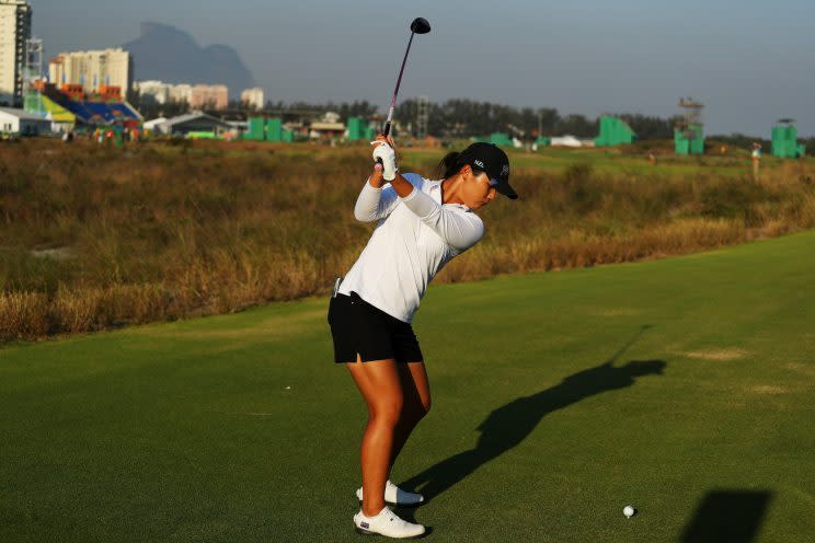 Lydia Ko bolts under the leaderboard on Friday in Rio. (Getty Images)