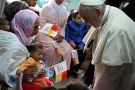 Pope Francis met unwell children at a health centre on Sunday morning