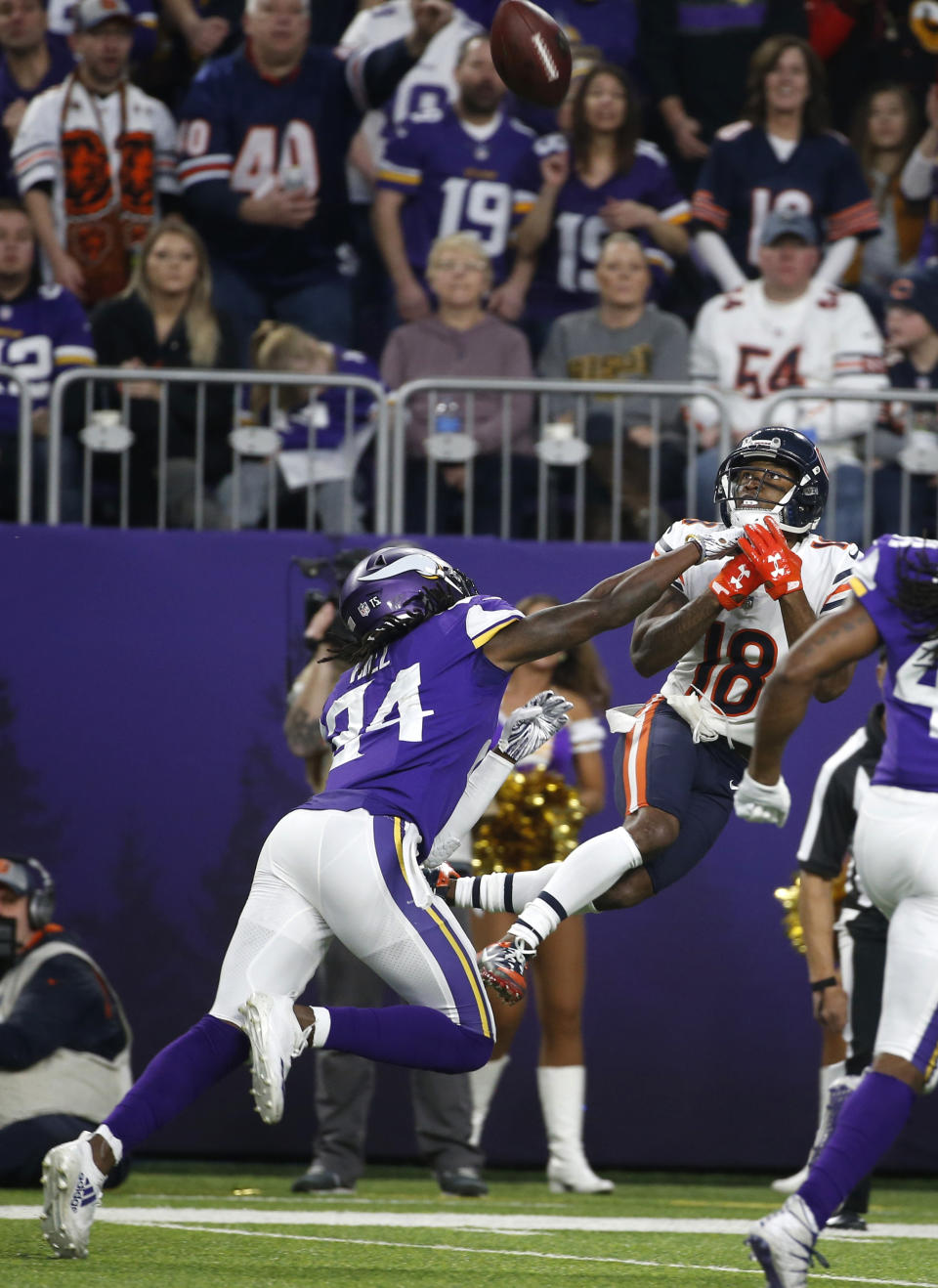 Chicago Bears wide receiver Taylor Gabriel (18) catches a pass over Minnesota Vikings defensive back Holton Hill (24) during the first half of an NFL football game, Sunday, Dec. 30, 2018, in Minneapolis. (AP Photo/Bruce Kluckhohn)