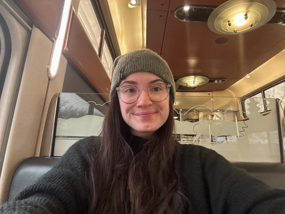 The author smiles for a selfie in the Amtrak's dining car.