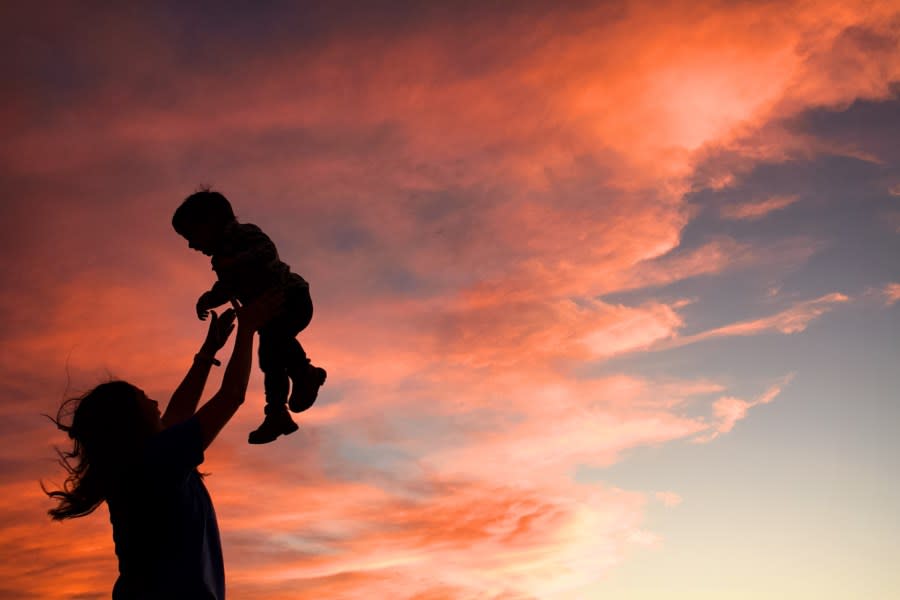 A woman plays with her nephew at sunset in Kyle on Dec. 3, 2023. The December 2023 KXAN Viewer Photo of the Month winner. (KXAN Viewer Photo)