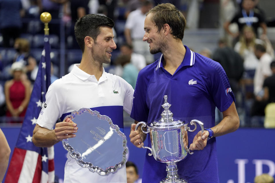 Novak Djokovic, of Serbia, left, and Daniil Medvedev, of Russia, talk during the trophy ceremony after the men's singles final of the US Open tennis championships, Sunday, Sept. 12, 2021, in New York. (AP Photo/John Minchillo)