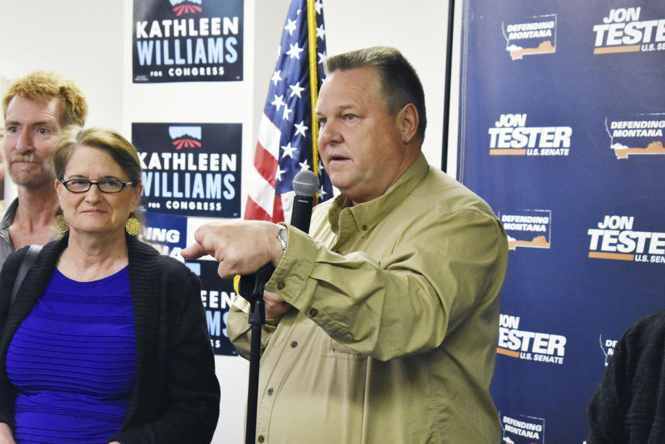 Montana Democratic Sen. Jon Tester talks with supporters at a campaign rally at the Billings Education Association headquarters in Billings, Mont., Friday, Oct. 26, 2018. Conservative groups linked to wealthy donors are saturating Montana airwaves with ads attacking Tester as they try to capitalize on President Donald Trump's feud with the lawmaker. . (AP Photo/Matthew Brown)