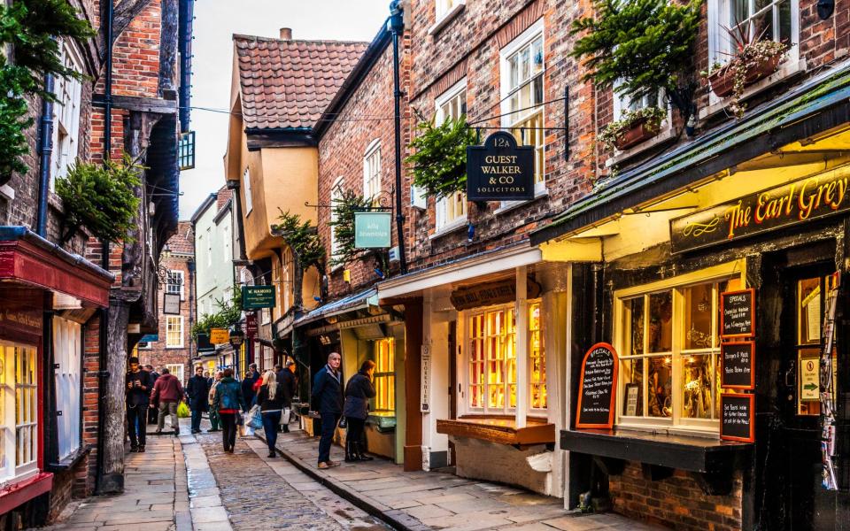 christmas shopping britain uk high streets travel holiday gifts festive town centres - Getty